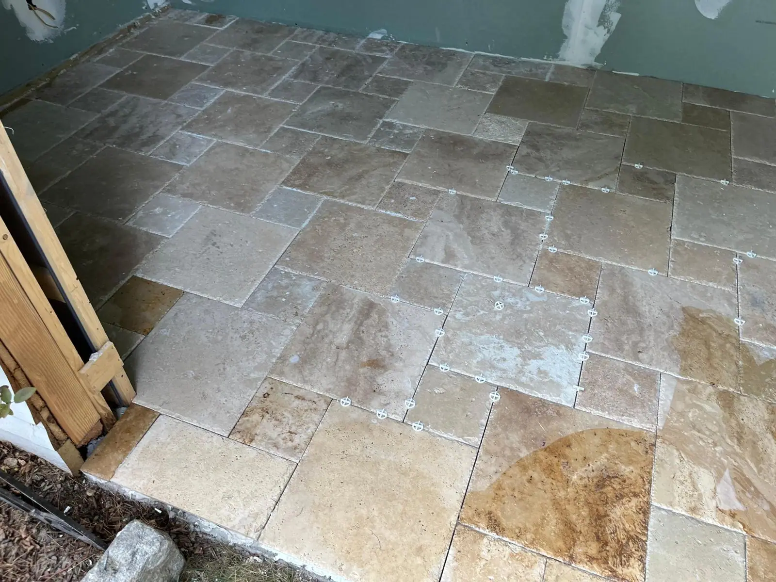 Finished travertine floor in a French pattern